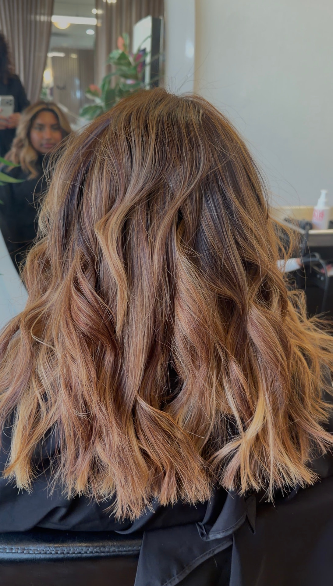 Warm copper balayage with soft beachy waves