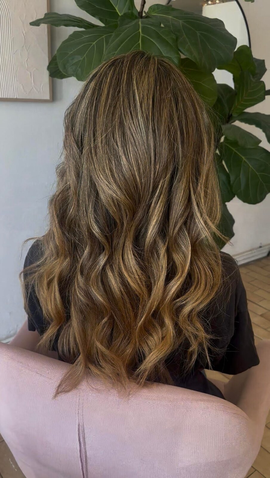 Soft caramel waves and dimensional balayage